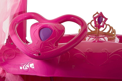 Disney Princess Pink Carriage has a heart-shaped steering wheel with a button that plays music and lights up!